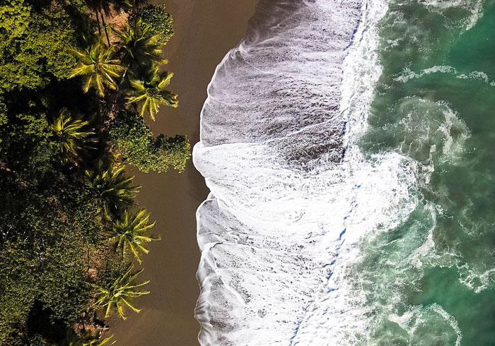 Tropical coastline near Puerto Jiménez, Costa Rica with clear waters and lush surroundings